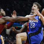 
              Cleveland Cavaliers guard Donovan Mitchell, left, knocks the ball away from Orlando Magic forward Franz Wagner (22) during the second half of an NBA basketball game, Friday, Dec. 2, 2022, in Cleveland. (AP Photo/Ron Schwane)
            