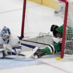 
              Toronto Maple Leafs goaltender Matt Murray, left, makes a save as Dallas Stars left wing Joel Kiviranta (25) slides into the net on a shot attempt in the second period of an NHL hockey game, Tuesday, Dec. 6, 2022, in Dallas. (AP Photo/Tony Gutierrez)
            