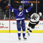 
              Tampa Bay Lightning's Steven Stamkos celebrates his 1,000th career point after assisting on a goal by Nicholas Paul during the second period of the team's NHL hockey game against the Philadelphia Flyers, Thursday, Dec. 1, 2022, in Philadelphia. (Yong Kim/The Philadelphia Inquirer via AP)
            