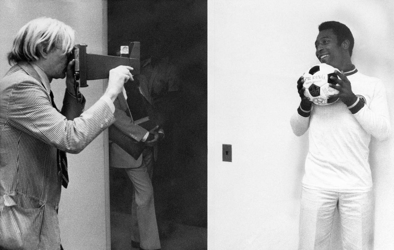 FILE - In this July 27, 1977, file photo, pop artist Andy Warhol, left, makes a photograph of Pele ...