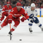 
              Detroit Red Wings center Michael Rasmussen (27) skates as Tampa Bay Lightning defenseman Mikhail Sergachev (98) gives chase during the first period of an NHL hockey game, Wednesday, Dec. 21, 2022, in Detroit. (AP Photo/Carlos Osorio)
            