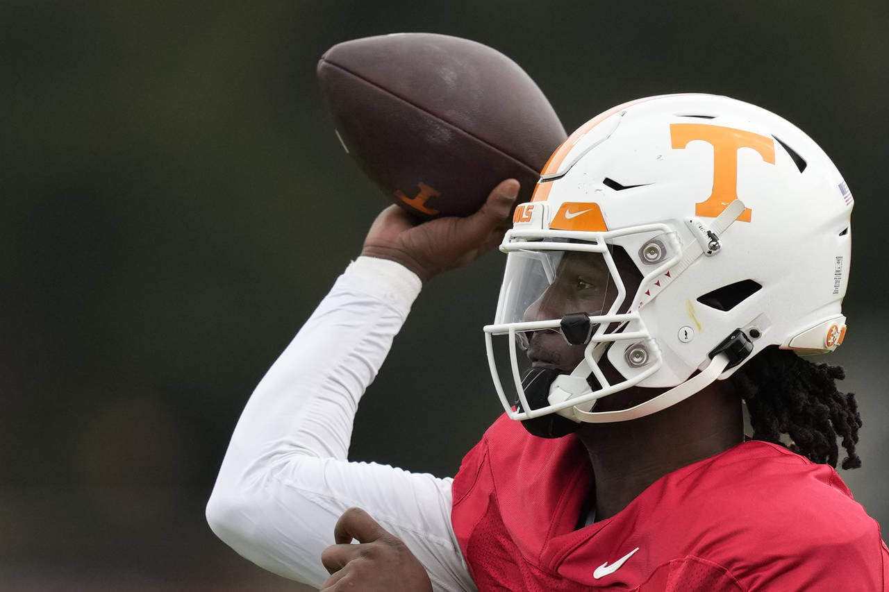 Tennessee Volunteers quarterback Joe Milton III (7) throws a pass during a practice session ahead o...