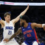
              Detroit Pistons forward Saddiq Bey (41) works the ball against Orlando Magic center Moritz Wagner (21) during the first half of an NBA basketball game Wednesday, Dec. 28, 2022, in Detroit. (AP Photo/Duane Burleson)
            