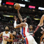 
              Detroit Pistons forward Saddiq Bey goes to the basket as Miami Heat forward Duncan Robinson defends during the first half of an NBA basketball game, Tuesday, Dec. 6, 2022, in Miami. (AP Photo/Lynne Sladky)
            