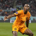 
              Denzel Dumfries of the Netherlands celebrates scoring his side's 3rd goal during the World Cup round of 16 soccer match between the Netherlands and the United States, at the Khalifa International Stadium in Doha, Qatar, Saturday, Dec. 3, 2022. (AP Photo/Ashley Landis)
            