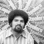 
              FILE - Pittsburgh Steelers running back Franco Harris, named as offensive rookie of the year by The Associated Press, is pictured before a collage of posters in the team offices in Pittsburgh, Jan. 2, 1973. Franco Harris, the Hall of Fame running back whose heads-up thinking authored “The Immaculate Reception,” considered the most iconic play in NFL history, died Wednesday, Dec. 21, 2022. He was 72. (AP Photo/Harry Cabluck, File)
            