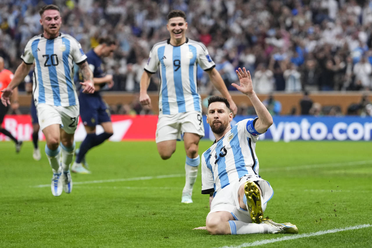 Argentina's Lionel Messi celebrates scoring his side's opening goal during the World Cup final socc...