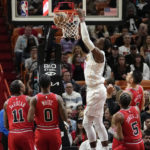 
              Miami Heat center Bam Adebayo dunks during the first half of an NBA basketball game against the Chicago Bulls, Tuesday, Dec. 20, 2022, in Miami. (AP Photo/Lynne Sladky)
            