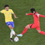 
              South Korea's Son Heung-min, right, and Brazil's Marquinhos vie for the ball during the World Cup round of 16 soccer match between Brazil and South Korea, at the Education City Stadium in Al Rayyan, Qatar, Monday, Dec. 5, 2022. (AP Photo/Pavel Golovkin)
            