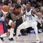 
              Houston Rockets guard Kevin Porter Jr., left, keeps the ball from Dallas Mavericks guard McKinley Wright IV (23) during the first half of an NBA basketball game in Dallas, Thursday, Dec. 29, 2022. (AP Photo/LM Otero)
            