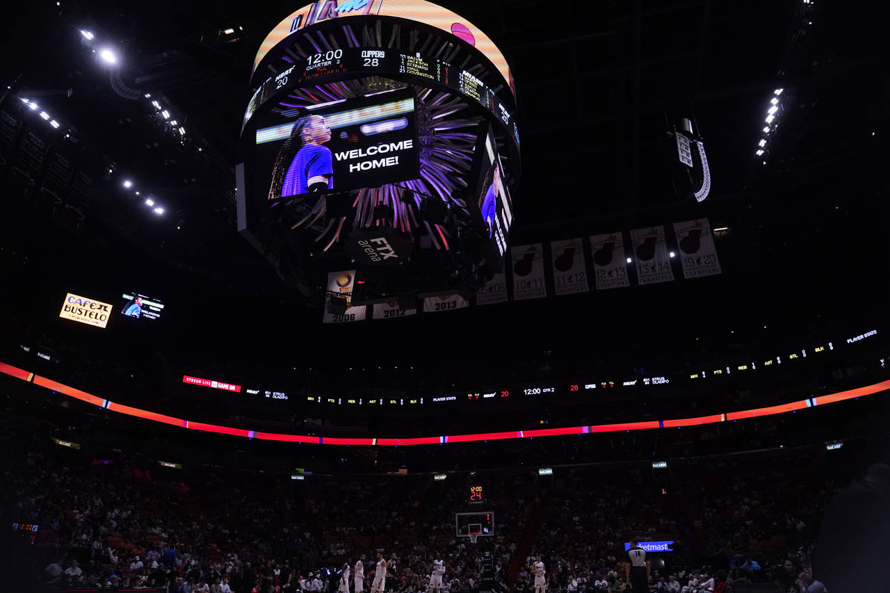 Brittney Griner is welcomed home on a large screen during the first half of an NBA basketball game ...