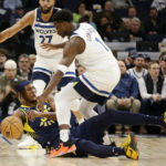 
              Minnesota Timberwolves guard Anthony Edwards (1) pressures Indiana Pacers center Myles Turner (33) in the first quarter of an NBA basketball game Wednesday, Dec. 7, 2022, in Minneapolis. (AP Photo/Andy Clayton-King)
            