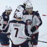 
              Columbus Blue Jackets' Kirill Marchenko (86) celebrates with teammates Sean Kuraly (7), Marcus Bjork (47) and Carson Meyer (72) after scoring a goal during the second period of an NHL hockey game against the Chicago Blackhawks Friday, Dec. 23, 2022, in Chicago. (AP Photo/Paul Beaty)
            