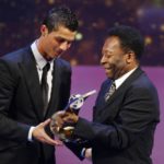 
              FILE - Soccer player Cristiano Ronaldo from Portugal, left, receives the trophy from former Brazilian soccer star Pele, right, after being named FIFA World Player of the Year during the FIFA World Player Gala 2008 at the Opera house in Zurich, Switzerland, Monday, Jan.12, 2009. (AP Photo/KEYSTONE/Steffen Schmidt, File)
            