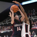 
              Gonzaga guard Kaylynne Truong (14) is fouled by Stanford guard Agnes Emma-Nnopu during the first half of an NCAA college basketball game in Stanford, Calif., Sunday, Dec. 4, 2022. (AP Photo/Tony Avelar)
            