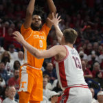 
              Tennessee forward Jonas Aidoo shoots over Arizona forward Henri Veesaar (13) during the first half of an NCAA college basketball game, Saturday, Dec. 17, 2022, in Tucson, Ariz. (AP Photo/Rick Scuteri)
            