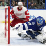 
              Tampa Bay Lightning goaltender Andrei Vasilevskiy (88) makes a save on a shot by Detroit Red Wings left wing Dominik Kubalik (81) during the first period of an NHL hockey game Tuesday, Dec. 6, 2022, in Tampa, Fla. (AP Photo/Chris O'Meara)
            
