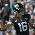 
              Jacksonville Jaguars quarterback Trevor Lawrence (16) sets back to pass during the first half of an NFL football game against the Dallas Cowboys, Sunday, Dec. 18, 2022, in Jacksonville, Fla. (AP Photo/Phelan M. Ebenhack)
            