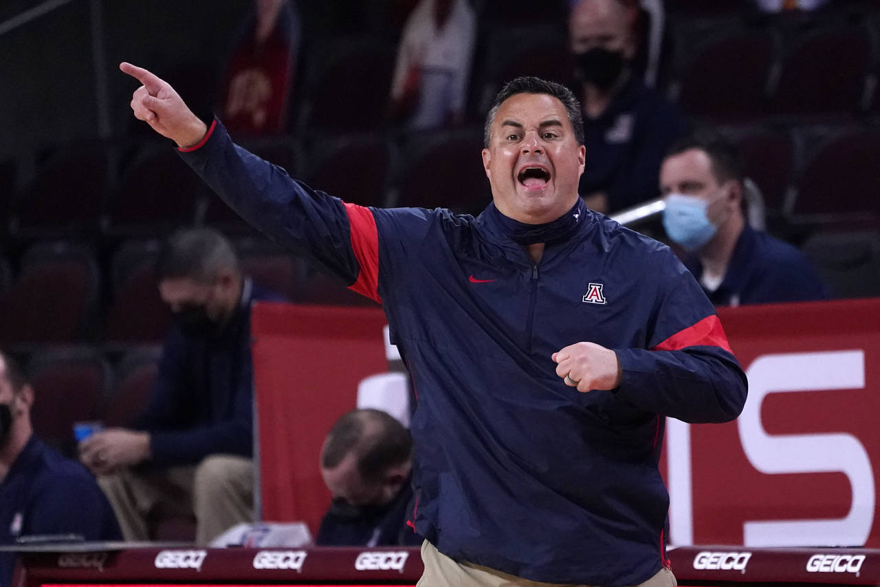 FILE - Arizona head coach Sean Miller instructs from the bench during the first half of an NCAA col...