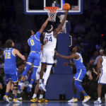 
              Kentucky forward Oscar Tshiebwe (34) attempts a layup during the second half of an NCAA college basketball game against UCLA in the CBS Sports Classic, Saturday, Dec. 17, 2022, in New York. The Bruins won 63-53. (AP Photo/Julia Nikhinson)
            