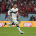 
              Portugal's Cristiano Ronaldo enters the pitch during the World Cup quarterfinal soccer match between Morocco and Portugal, at Al Thumama Stadium in Doha, Qatar, Saturday, Dec. 10, 2022. (AP Photo/Martin Meissner)
            