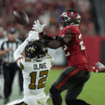 
              Tampa Bay Buccaneers safety Keanu Neal (22) brake up a pass intended for New Orleans Saints wide receiver Chris Olave (12) in the first half of an NFL football game in Tampa, Fla., Monday, Dec. 5, 2022. (AP Photo/Chris O'Meara)
            