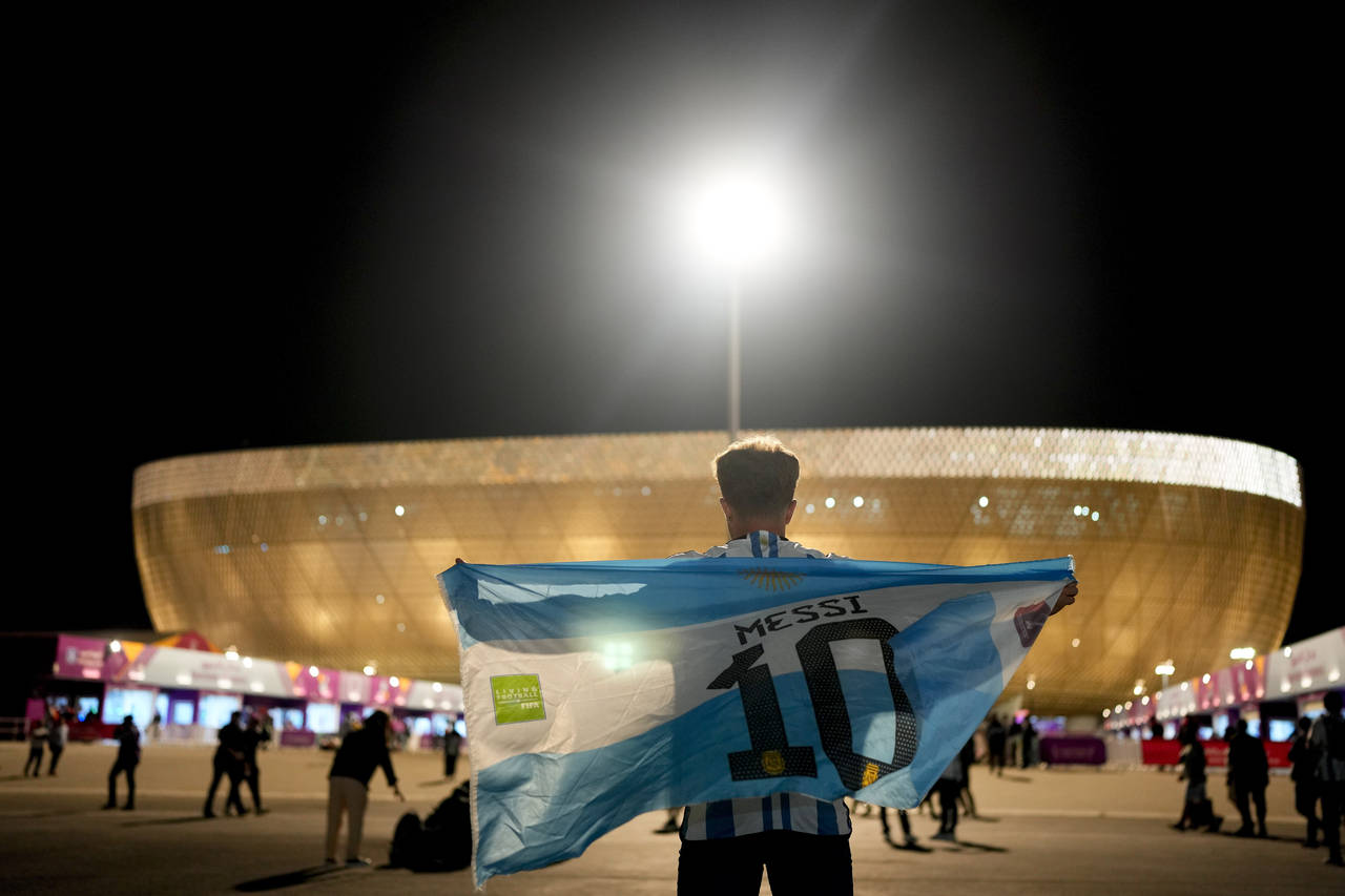 A man holds an Argentinian flag prior to the World Cup quarterfinal soccer match between the Nether...