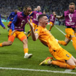 
              Wout Weghorst of the Netherlands celebrates after scoring his side's second goal during the World Cup quarterfinal soccer match between the Netherlands and Argentina, at the Lusail Stadium in Lusail, Qatar, Saturday, Dec. 10, 2022. (AP Photo/Ricardo Mazalan)
            