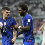 
              Christian Pulisic of the United States, left, and Yunus Musah of the United States speak before a free kick during the World Cup group B soccer match between Iran and the United States at the Al Thumama Stadium in Doha, Qatar, Tuesday, Nov. 29, 2022. (AP Photo/Ebrahim Noroozi)
            