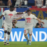 
              Switzerland's Xherdan Shaqiri, right, celebrates with teammate Breel Embolo after scoring his side's first goal during the World Cup group G soccer match between Serbia and Switzerland, in Doha, Qatar, Qatar, Friday Dec. 2, 2022. (AP Photo/Ricardo Mazalan)
            