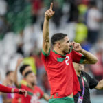 
              Morocco's Achraf Hakimi celebrates his team victory at the end of the World Cup round of 16 soccer match between Morocco and Spain, at the Education City Stadium in Al Rayyan, Qatar, Tuesday, Dec. 6, 2022. (AP Photo/Martin Meissner)
            