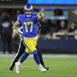 
              Los Angeles Rams quarterback Baker Mayfield scrambles out of the pocket during the first half of an NFL football game against the Las Vegas Raiders, Thursday, Dec. 8, 2022, in Inglewood, Calif. (AP Photo/Mark J. Terrill)
            