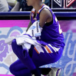 
              Hansel Enmanuel, a freshman guard from the Dominican Republic for Northwestern State, waits at the scorers table to enter an NCAA college basketball game against Rice Saturday, Dec. 17, 2022, in Houston. Enmanuel lost his left arm in a childhood accident and has attained the talent and skill to play at the college level. (AP Photo/Michael Wyke)
            