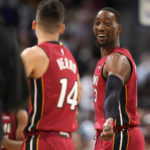 
              Miami Heat center Bam Adebayo, right, jokes with guard Tyler Herro as they take the court in the first half of an NBA basketball game against the Denver Nuggets, Friday, Dec. 30, 2022, in Denver. (AP Photo/David Zalubowski)
            