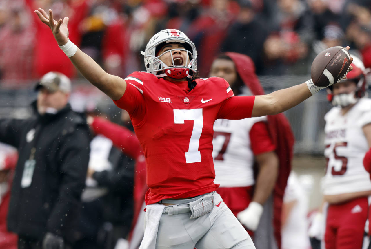 FILE - Ohio State quarterback C.J. Stroud celebrates after a long run against Indiana during the se...
