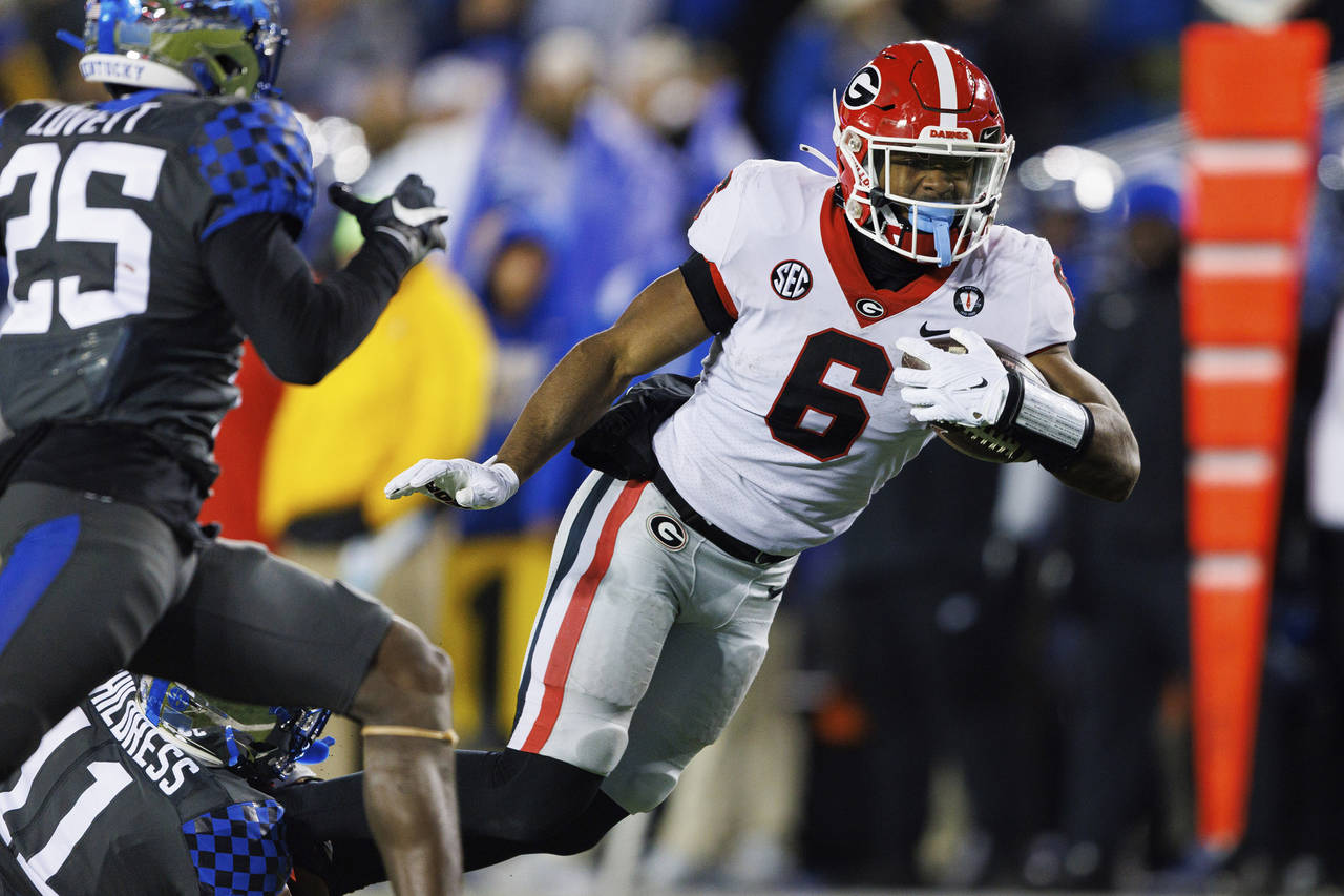 FILE - Georgia running back Kenny McIntosh (6) is tackled by Kentucky defensive back Zion Childress...