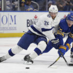 
              Tampa Bay Lightning center Brayden Point (21) and Buffalo Sabres right wing Tage Thompson (72) battle for possession of the puck during the second period of an NHL hockey game Monday, Nov. 28, 2022, in Buffalo, N.Y. (AP Photo/Joshua Bessex)
            