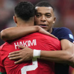 
              France's Kylian Mbappe hugs Morocco's Achraf Hakimi at the end of the World Cup semifinal soccer match between France and Morocco at the Al Bayt Stadium in Al Khor, Qatar, Wednesday, Dec. 14, 2022. France won 2-0 and will play Argentina in Sunday's final. (AP Photo/Manu Fernandez)
            
