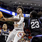 
              Auburn guard Wendell Green Jr. (1) is fouled by Georgia State center Joe Jones III (23) as he shoots during the second half of an NCAA college basketball game Wednesday, Dec. 14, 2022, in Auburn, Ala. (AP Photo/Butch Dill)
            