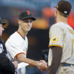 
              FILE - San Francisco Giants' Tyler Rogers, left, shakes hands with his brother San Diego Padres' Taylor Rogers (17) as they exchange lineups before their game in San Francisco, on Monday, April 11, 2022.  Left-hander Taylor Rogers is joining twin brother Tyler as a reliever with the San Francisco Giants, agreeing to a $33 million, three-year contract, Wednesday, Dec. 28, 2022.(Nhat V. Meyer/Bay Area News Group via AP, File)
            