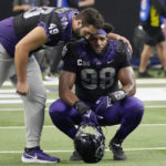 
              TCU's Connor Lingren (49) consoles teammate Dylan Horton (98) after Kansas State defeated them in the Big 12 Conference championship NCAA college football game, Saturday, Dec. 3, 2022, in Arlington, Texas. (AP Photo/LM Otero)
            