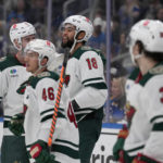 
              Minnesota Wild's Jordan Greenway (18) is congratulated by teammates after scoring during the third period of an NHL hockey game against the St. Louis Blues Saturday, Dec. 31, 2022, in St. Louis. (AP Photo/Jeff Roberson)
            