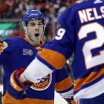 
              New York Islanders center Jean-Gabriel Pageau congratulates Brock Nelson for a goal against the New Jersey Devils during the second period of an NHL hockey game Friday, Dec. 9, 2022, in Newark, N.J. (AP Photo/Adam Hunger)
            