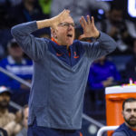 
              Syracuse head coach Jim Boeheim gestures towards his players as they compete against Notre Dame during the first half of an NCAA college basketball game on Saturday, Dec. 3, 2022 in South Bend, Ind. (AP Photo/Michael Caterina)
            