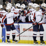
              Washington Capitals defenseman Erik Gustafsson (56) celebrates with teammates after scoring a goal against the New York Rangers during the second period of an NHL hockey game Tuesday, Dec. 27, 2022, in New York. (AP Photo/Adam Hunger)
            