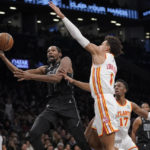 
              Brooklyn Nets forward Kevin Durant (7) goes to the basket against Atlanta Hawks forward Jalen Johnson (1) during the second half of an NBA basketball game Friday, Dec. 9, 2022, in New York. The Nets won 120-116. (AP Photo/Mary Altaffer)
            