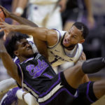 
              Kansas State guard Markquis Nowell (1) tries to steal the ball from Abilene Christian guard Ja'Sean Jackson (2) during the first half of an NCAA college basketball game Tuesday, Dec. 6, 2022, in Manhattan, Kan. (AP Photo/Charlie Riedel)
            