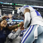 
              Dallas Cowboys safety Israel Mukuamu (24) celebrates with fans after intercepting pass in the finals second of an NFL football game against the Houston Texans, Sunday, Dec. 11, 2022, in Arlington, Texas. (AP Photo/Michael Ainsworth)
            