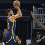 
              Golden State Warriors guard Stephen Curry, left, shoots a 3-point basket over Houston Rockets forward Tari Eason (17) during the first half of an NBA basketball game in San Francisco, Saturday, Dec. 3, 2022. (AP Photo/Godofredo A. Vásquez)
            