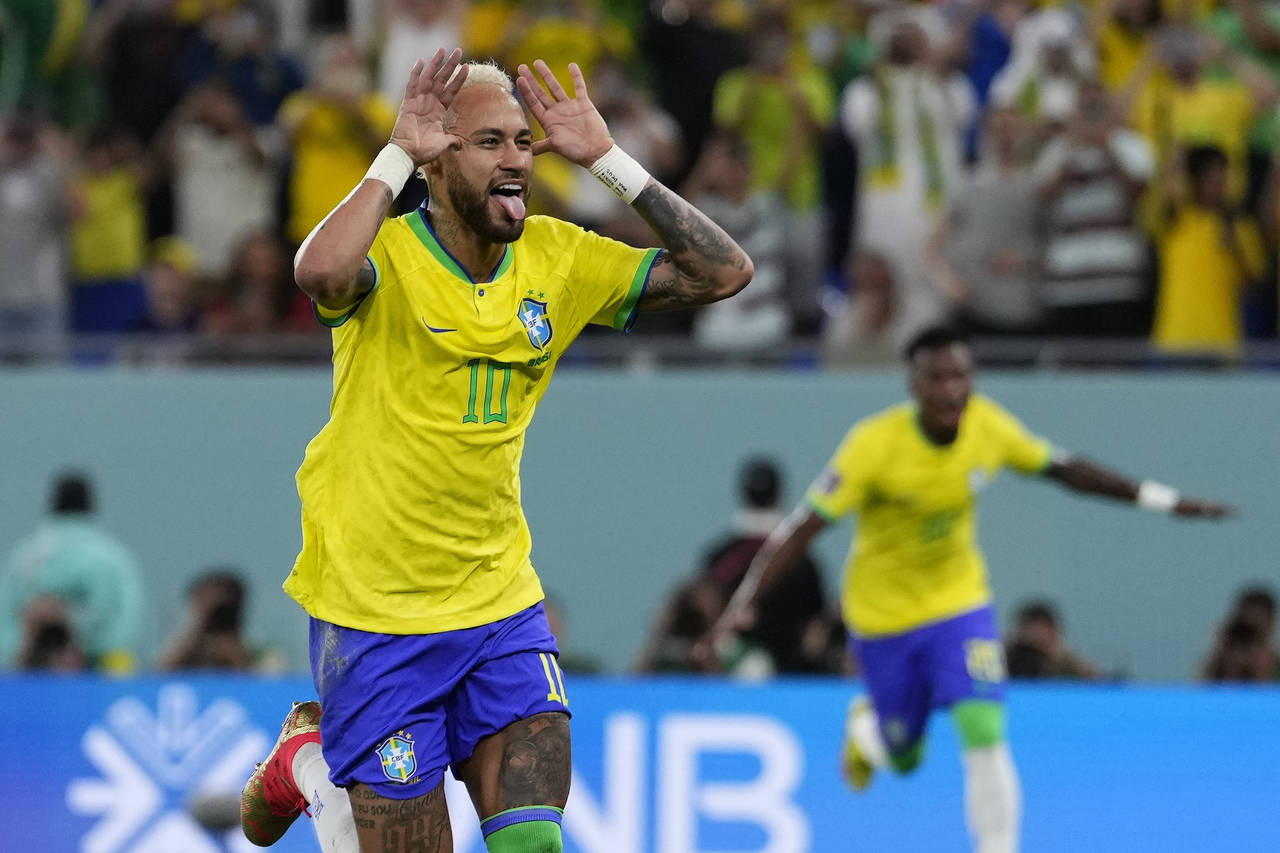 Brazil's Neymar celebrates after scoring his side's second goal during the World Cup round of 16 so...